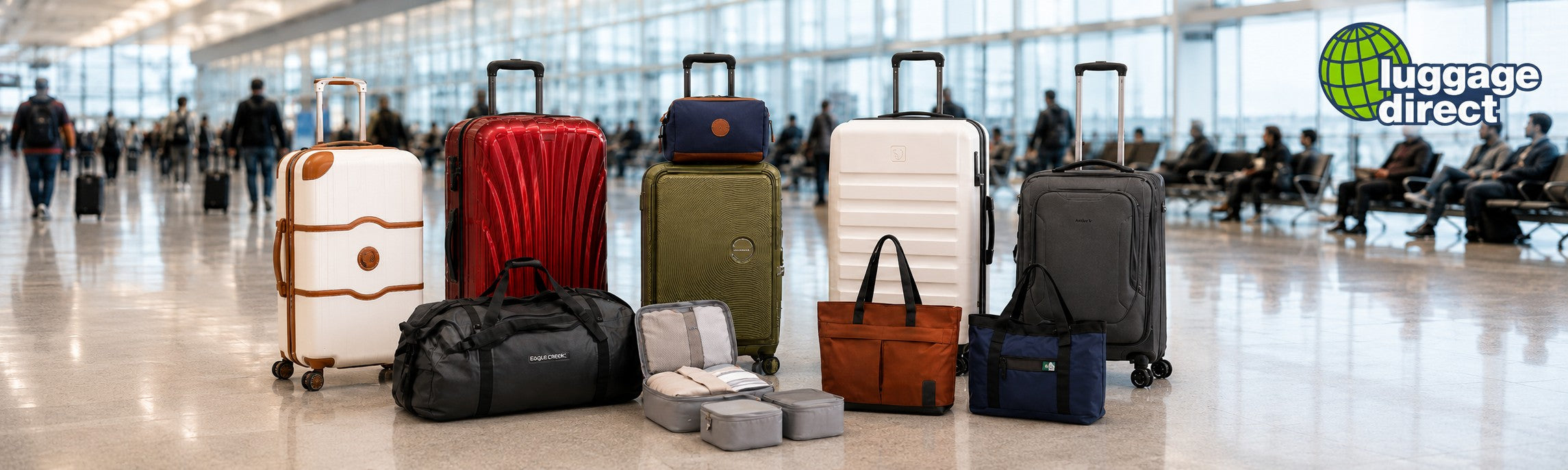 Assorted suitcases, duffel bags, and travel organizers arranged on a polished airport terminal floor.
